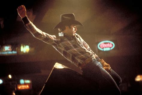 Did John Travolta do his own bull riding in Urban Cowboy?