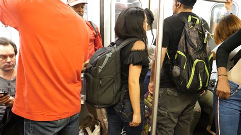 Is it okay to wear a backpack on the subway?