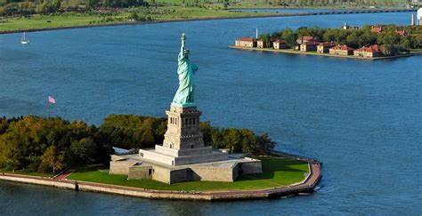 What is the difference between Ellis Island and the Statue of Liberty?