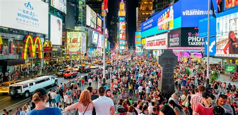 Why do tourists go to Times Square?