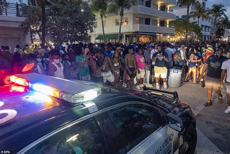 Why is there a curfew in Miami Beach?